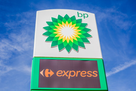 LYON, FRANCE - FEBRUARY 26, 2019: BP plc (formerly The British Petroleum Company plc) British multinational oil and gas company logo on its gas service station in Lyon, France on blue sky backgroundのeditorial素材