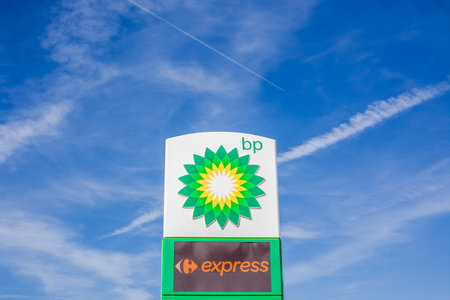 LYON, FRANCE - FEBRUARY 26, 2019: BP plc (formerly The British Petroleum Company plc) British multinational oil and gas company logo on its gas service station in Lyon, France on blue sky backgroundのeditorial素材