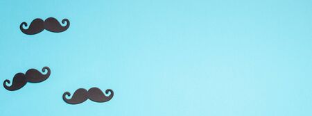 Creative flatlay overhead top view retro stylish black paper photo booth props moustaches turquoise...