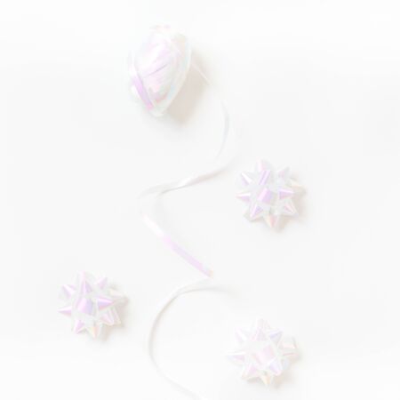 Holographic streamer ribbon in Creative conceptual top view flat lay square composition with copy space isolated on white background in minimal styleの写真素材