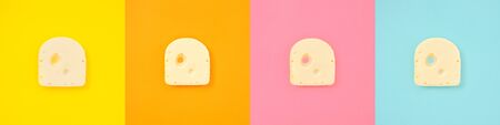 Cheese piece collage in Creative conceptual top view flat lay set of color squares with copy space isolated on bold orange, yellow, pink, blue background in minimal styleの写真素材