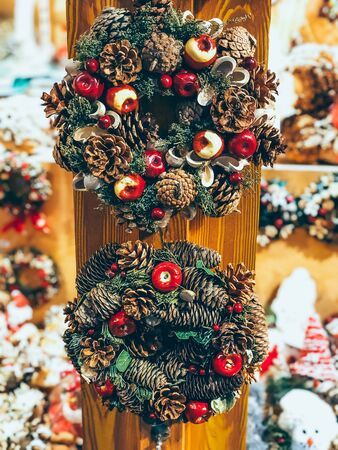 Beautiful Christmas wreath decoration on outdoor Christmas market in Munich. Mobile photoの写真素材