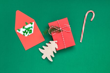 New Year or Christmas top view Xmas holiday celebration red present gift box copy space green color paper background. Template greeting cardの写真素材