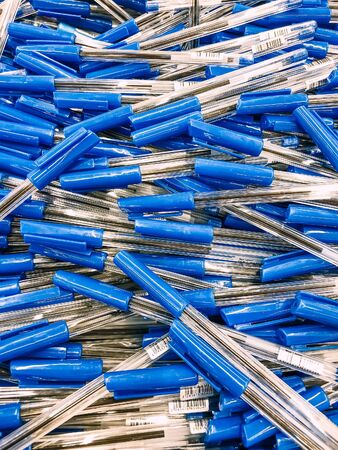 Ballpoint pen pile in stationery shop. Back to school shopping. Mobile photo, top viewの写真素材