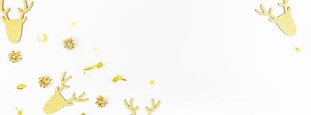 Christmas composition. New Year or Christmas pattern flat lay top view Xmas holiday celebration deer decorative golden frame on white background with copy space. Template of greeting cardの写真素材