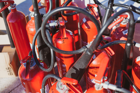 CANNES, FRANCE - JANUARY 10, 2019: Fire extinguishers. Red metal safety emergency equipment outdoorsのeditorial素材