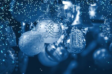 Christmas decoration on an european market. Holiday shopping. Color of the year 2020 classic blue toned postcardの写真素材