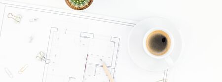 Creative flat lay overhead top view blueprint flat project plan hot coffee cup and office supplies...