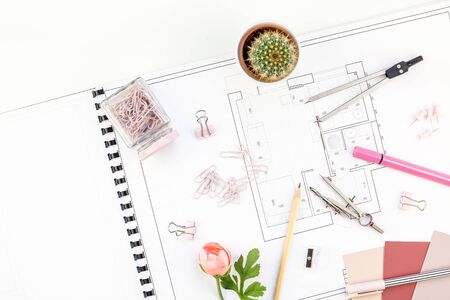 Blueprint flat project plan and office supplies on decorator table workspace. Swatches, tools and equipment background with copy space. Creative flat lay overhead top view conceptの写真素材