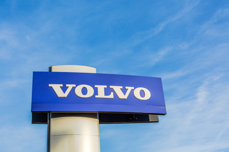 Volvo brand logo on bright blue sky background located on its sale office building in Lyon, France - February 23, 2020のeditorial素材