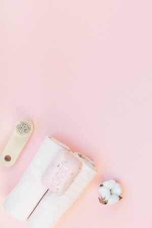 Spa, beauty cosmetics and body care treatment concept with copy space. Creative top view flat lay composition with bath accessories, organic rose soap on pink backgroundの写真素材
