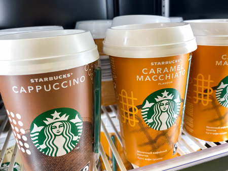 Starbucks coffee cups row ready to go in a supermarket fridge shelf. Mobile photography. Moscow, Russia - February 06, 2020のeditorial素材