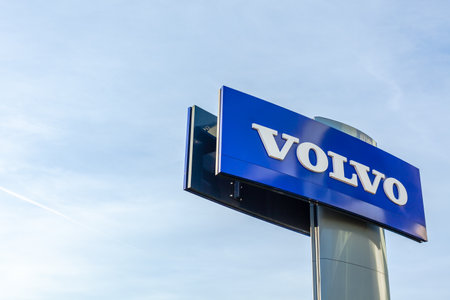 Volvo brand logo on bright blue sky background located on its sale office building in Lyon, France - February 23, 2020のeditorial素材