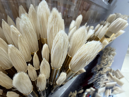 Paintbrushes with soft bristles standing in a holder for painting activities or artistic projects. Mobile photoの写真素材