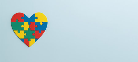 Autism Awareness Day heart-shaped puzzle concept on pale blue background, AI Generatedの素材