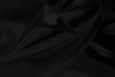 soft fabric abstract silky smooth curve decorative black background. Textile sharpen modern style full frameの写真素材