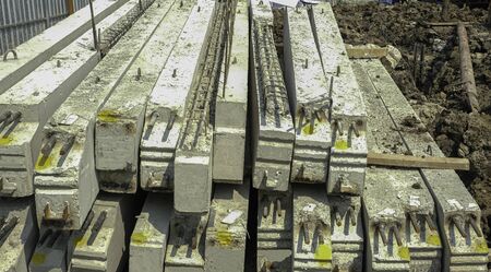 group of cement pole on ground in construction house siteの写真素材