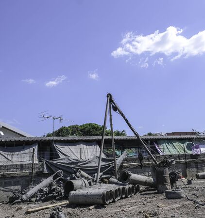 construction site  piling equipment. Building house.  three legs metal steel crane.の写真素材
