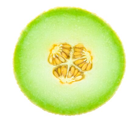 honeydew water melon circle slice. Center yellow group seed. Isolated on white backgroundの写真素材