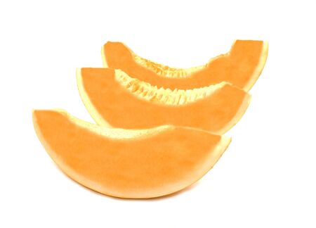 three fresh golden fruit slice. Isolated on white background. Yellow vegan food for saladの写真素材