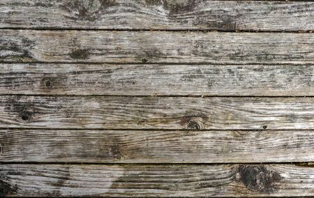 brown wooden plank fence wall peeling texture backgroundの写真素材