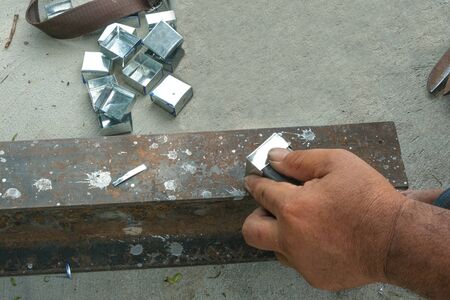 worker man use hand make dice aluminium.の写真素材