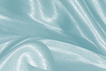 soft fabric wave motion blue green color abstract backgroundの写真素材