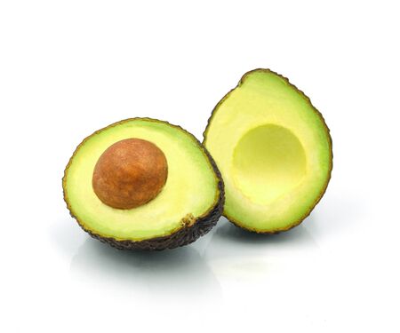 fresh avocado fruit with seed isolated on white background