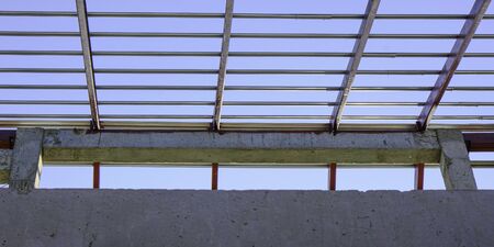 pattern on roof metal steel square frame structure for building construction concrete on sky...