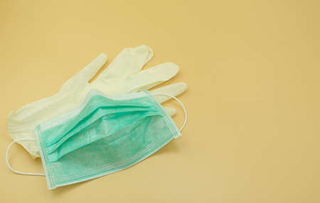 used green paper mask surgical on latex glove protect and filter dust pollution and disease virus....