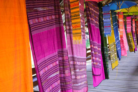 colorful soft fabric hanging show collection in building. thailand tradition culture fashion handmadeの写真素材