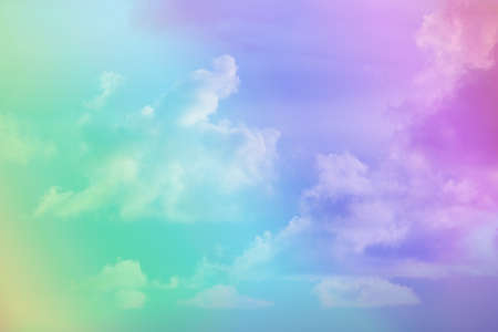 beauty abstract sweet pastel soft pink and green with fluffy clouds on sky. multi color rainbow image. fantasy growing lightの写真素材