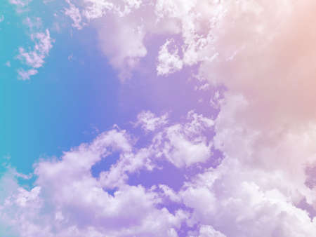 beauty sweet pastel violet orange colorful with fluffy clouds on sky. multi color rainbow image. abstract fantasy growing lightsの写真素材