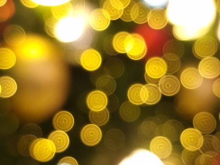abstract bokeh blur light circle red yellow and white glowing flare pattern black backgroundの写真素材