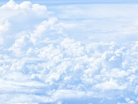 over blue sky on plane abstract shape outdoor group of white clouds background in summer gradient light beauty background. beautiful bright cloud and calm fresh wind airの写真素材
