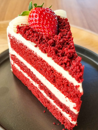 slice red velvet cake adorned with strawberries. sweet bakery food cafeの写真素材