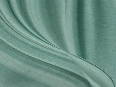 green abstract smooth beauty clean and vivid fabric textured. fashion textile free style shape decorate backgroundの写真素材
