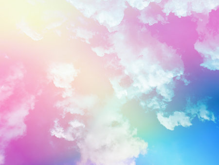 beauty sweet pastel yellow and blue colorful with fluffy clouds on sky. multi color rainbow image. abstract fantasy growing lightの写真素材