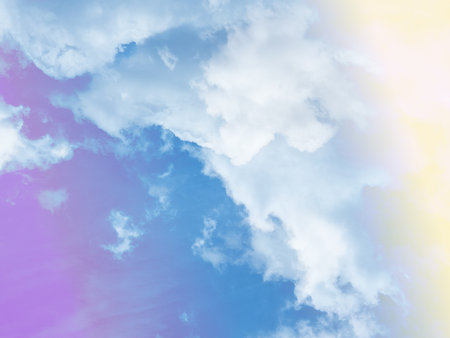 beauty sweet pastel yellow and blue colorful with fluffy clouds on sky. multi color rainbow image. abstract fantasy growing lightの写真素材
