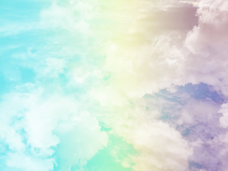 beauty sweet pastel yellow and blue colorful with fluffy clouds on sky. multi color rainbow image. abstract fantasy growing lightの写真素材