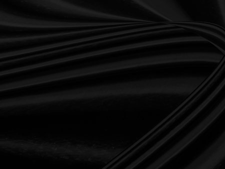 beauty fashion textile soft fabric black abstract. smooth curve shape matrix decorate backgroundの写真素材
