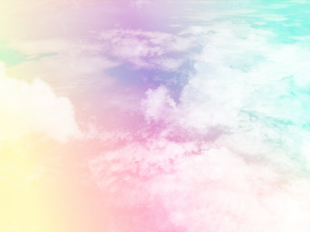 beauty sweet pastel yellow and blue colorful with fluffy clouds on sky. multi color rainbow image. abstract fantasy growing lightの写真素材