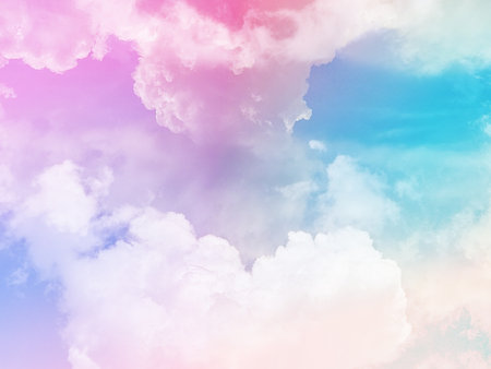 beauty sweet pastel blue and pink colorful with fluffy clouds on sky. multi color rainbow image. abstract fantasy growing lightの写真素材