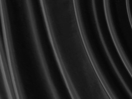 Clean abstract fashion woven beautiful soft fabric smooth curve shape decorative textile black backgroundの写真素材