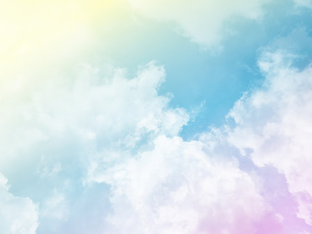 beauty sweet pastel pink and yellow colorful with fluffy clouds on sky. multi color rainbow image. abstract fantasy growing lightの写真素材
