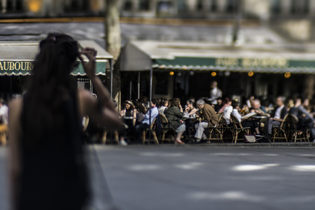 People having sun at cafe in Parisの写真素材
