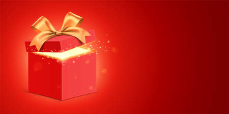Open red gift box with a golden ribbon and magical glitter light, shining from inside. Shiny present box standing on red gradient background, with copy space. Holiday gift vector banner design.のイラスト素材