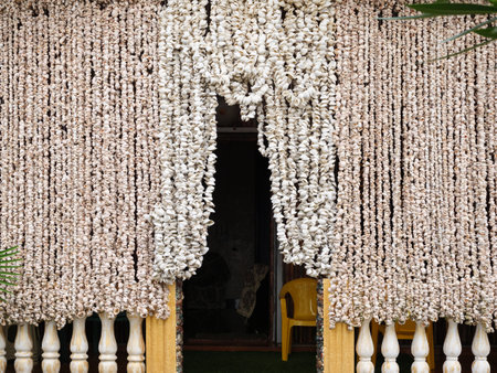 These stunning balcony curtains made from seashells create a unique coastal atmosphere in the home.の写真素材