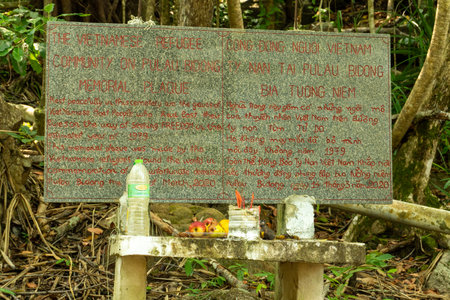 A memorial plaque in Pulau Bidong forest commemorates Vietnamese boat people who died seeking freedom in 1979. Created by refugees in March 2020.の写真素材