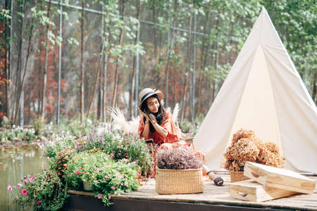 A young man's hand touched on a tablet, modern technology concept, empty space for text, studio photo on a black background.の写真素材